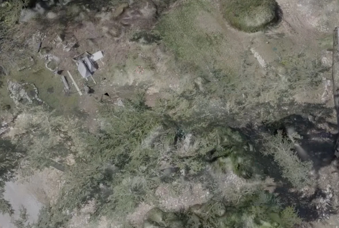 Drone aerial map of an undeveloped lot with a proposed building footprint, setback line and driveway drawn over it